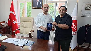 Yazar Özkul, Müftü İmamoğlu'na Kitabını Takdim Etti