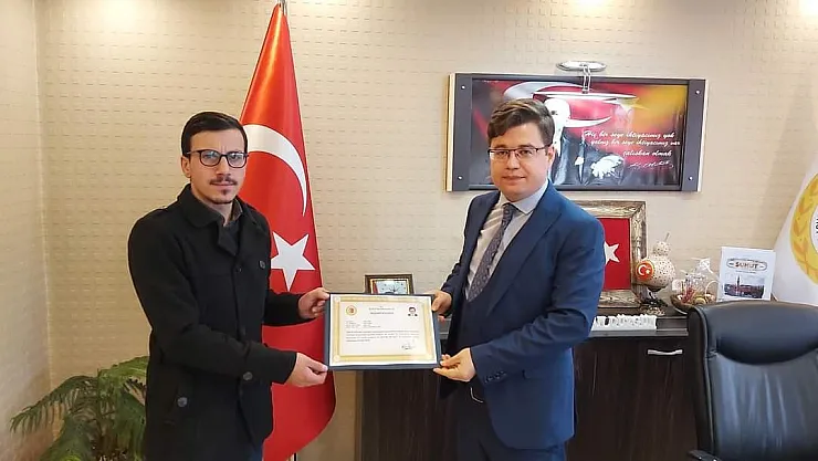 Yürekleri ısıtan imama başarı belgesi